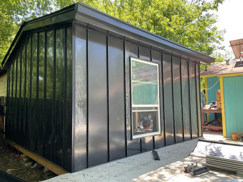 Black standing seam metal wall panels for Roof Inspection in White Lake