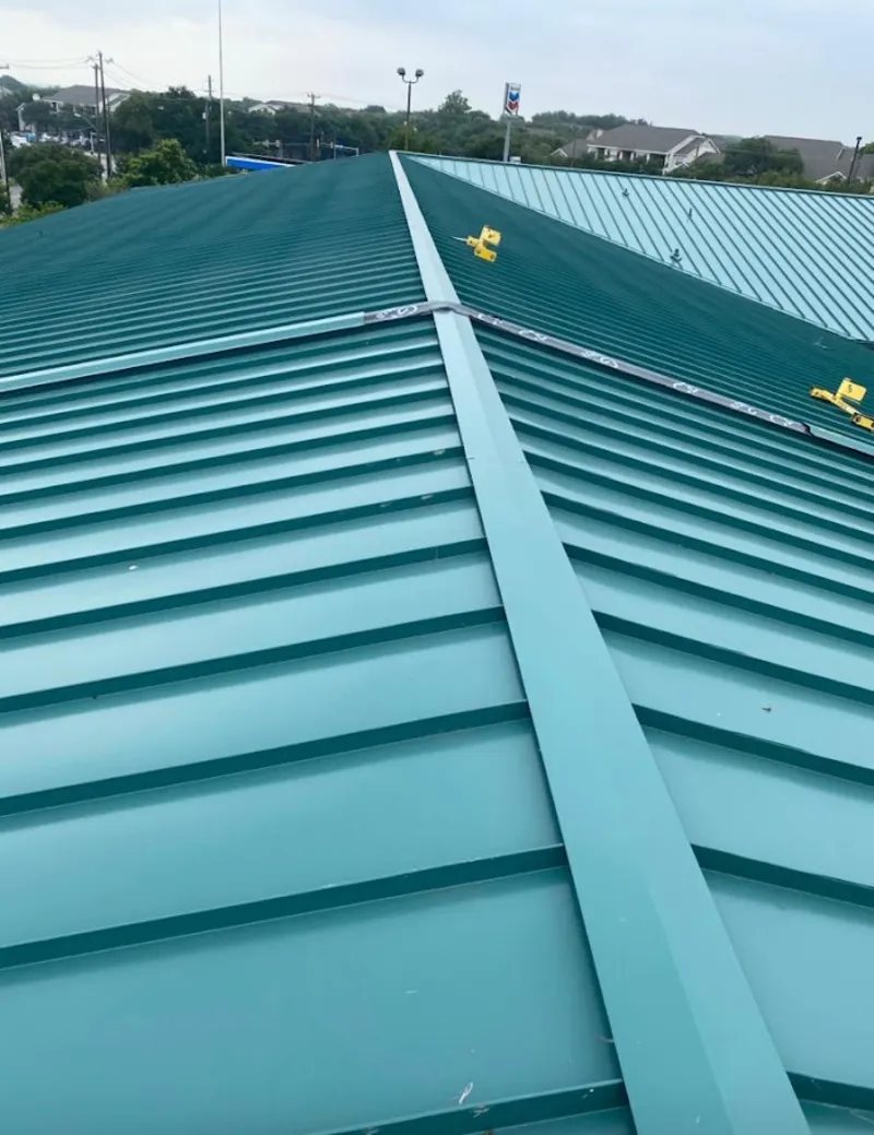 Green commercial metal roof ridge and valley for Metal Roof Repair in White Lake